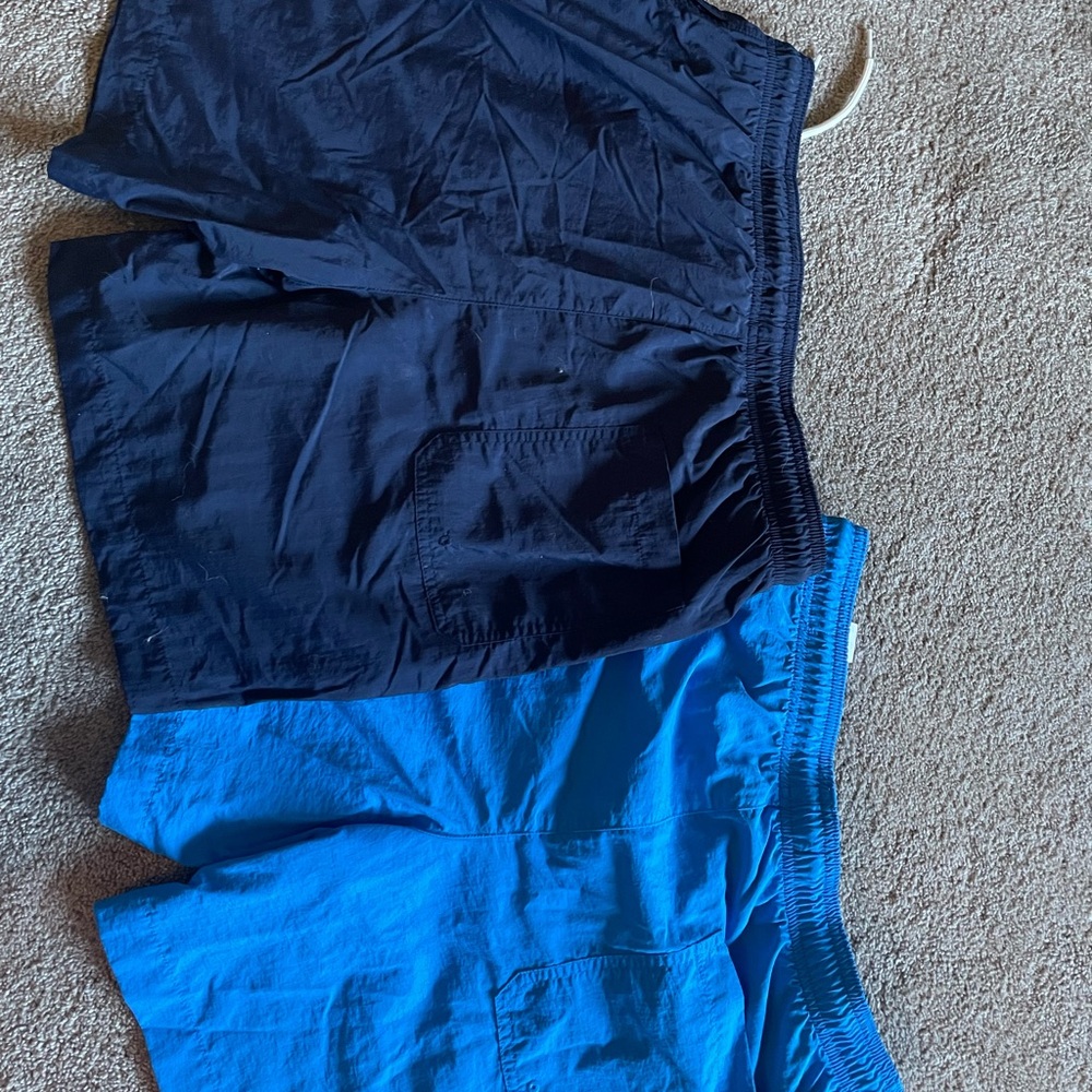Men’s size small swim shorts.  Aqua blue and dark blue